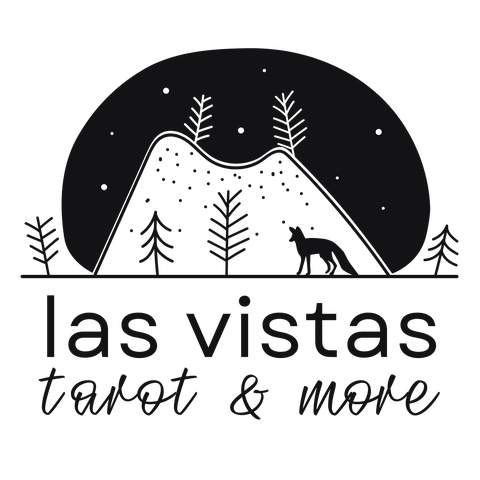 Las Vistas logo in black and light grey: a picture of a fox with a background of a mountain and trees under a night sky and words underneath: Las Vistas Tarot & More