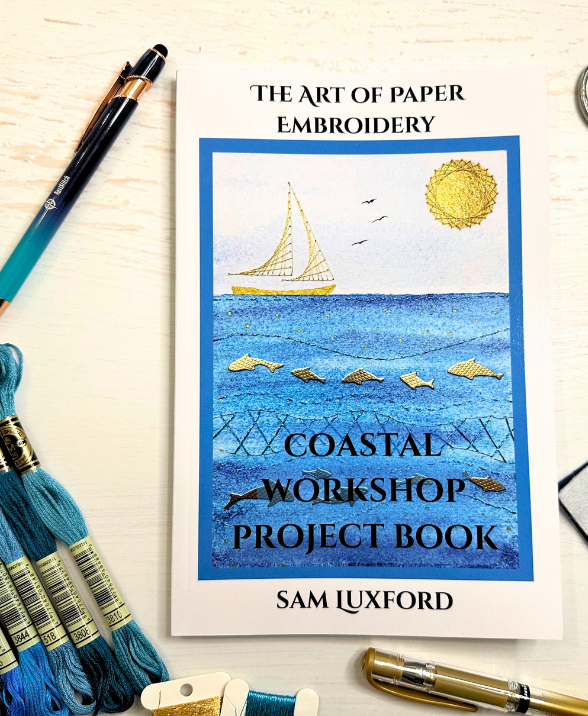Coastal Paper Embroidery Book surrounded by tools and materials