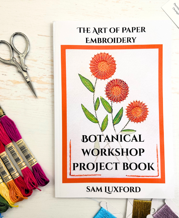 Botanical Paper Embroidery Book surrounded by tools and materials