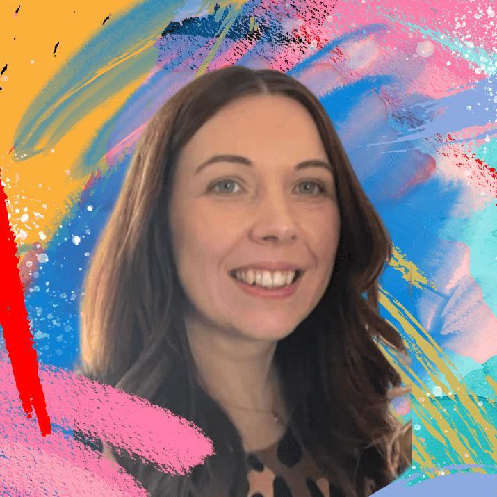 The artist herself is surrounded by colourful abstract shapes.