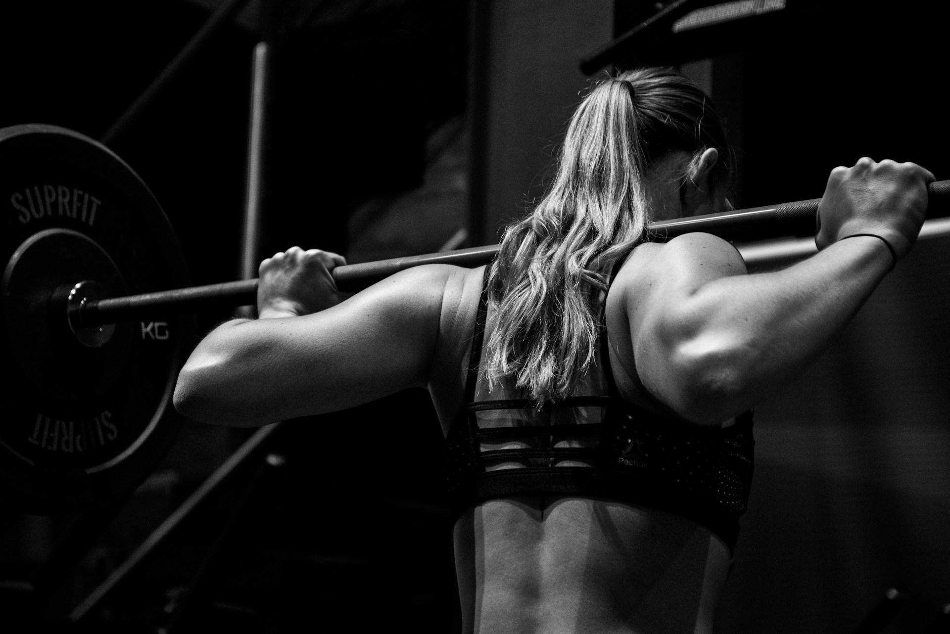 Photo by <a href="https://unsplash.com/@sxoxm?utm_content=creditCopyText&utm_medium=referral&utm_source=unsplash">Sven Mieke</a> on <a href="https://unsplash.com/photos/woman-lifting-barbell-jO6vBWX9h9Y?utm_content=creditCopyText&utm_medium=referral&utm_source=unsplash">Unsplash</a>