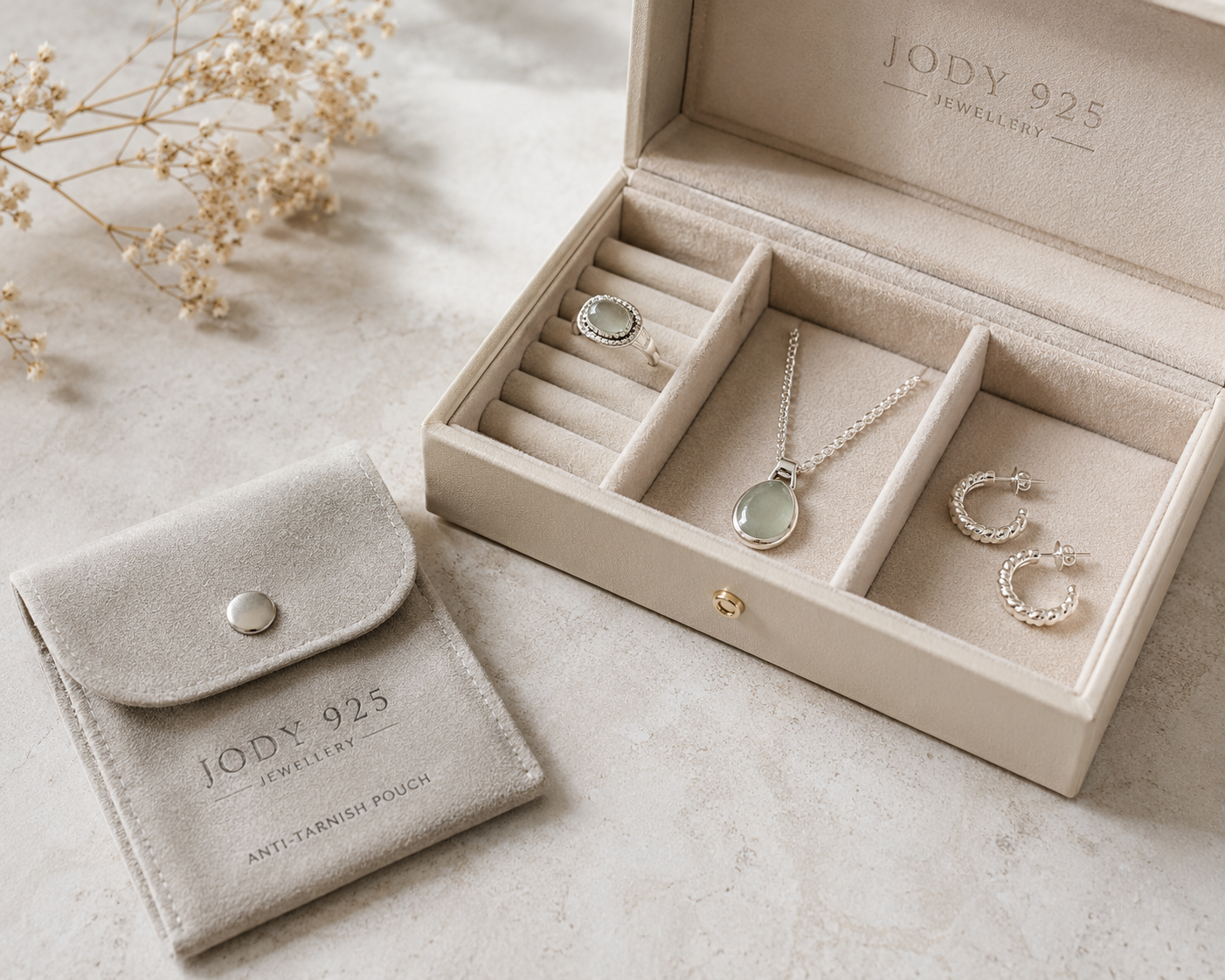 Jewellery box with sterling silver jewellery stored separately alongside an anti-tarnish pouch.