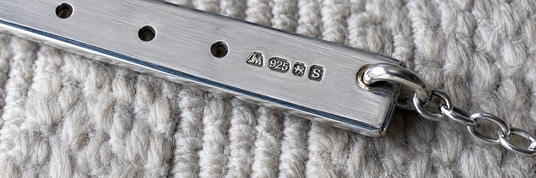Close-up of the official UK hallmarks on one of my handcrafted sterling silver necklaces after independent testing by the Assay Office.