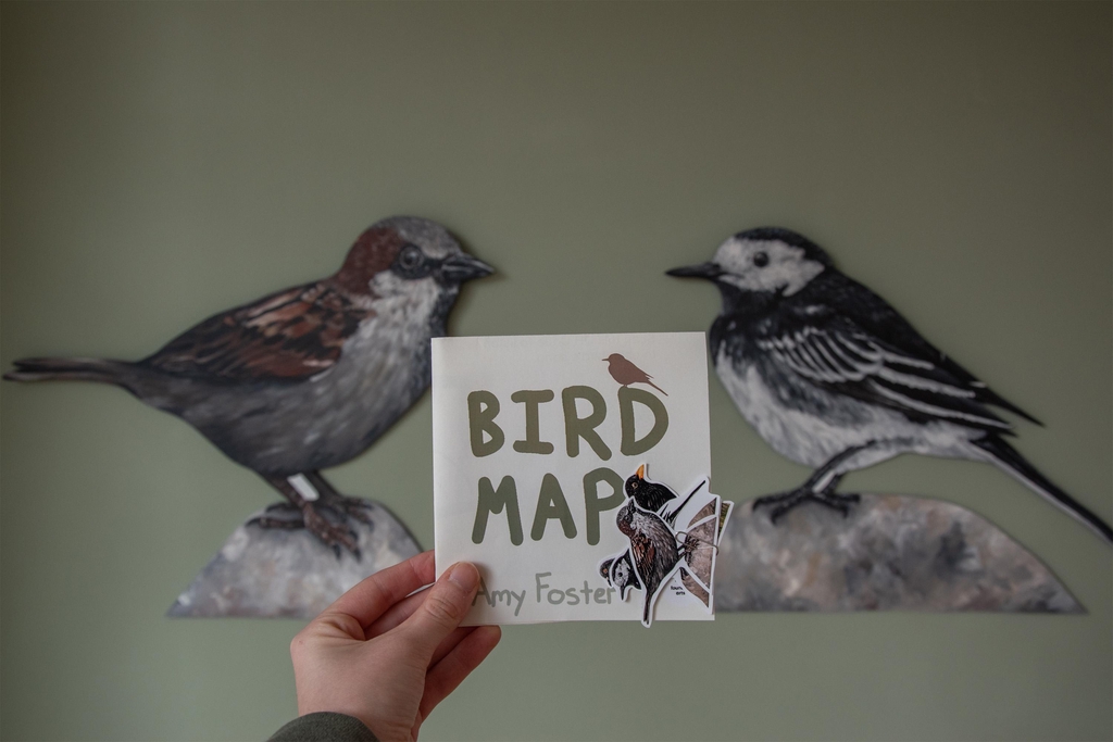 Bird Map 2026 exhibition - map interactive activity front with stickers held in gallery space - artist Amy Foster - Yellow Bird Art Studio