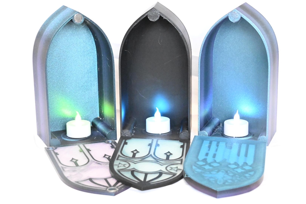 3 book-nooks open, showing the tealights inside