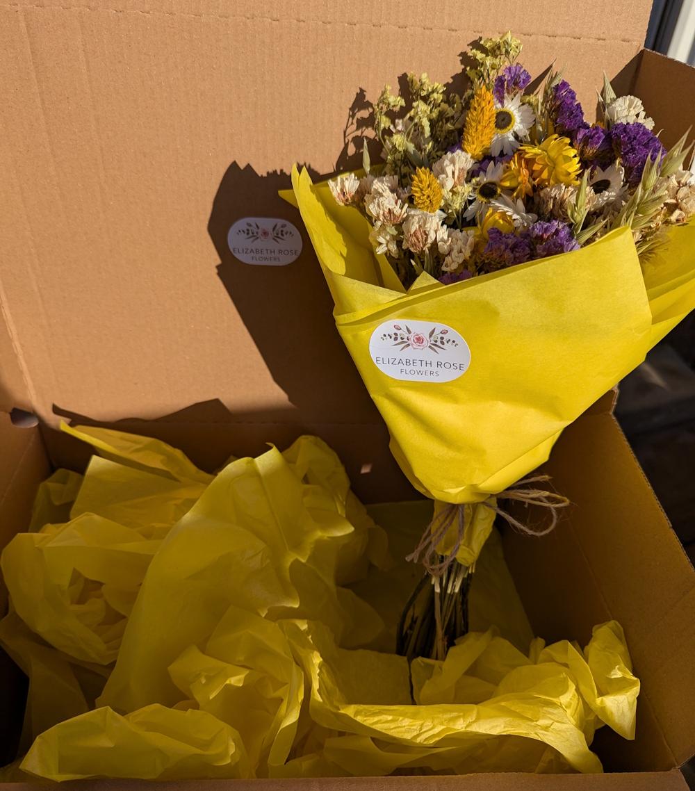 Dried flower bouquet in a shipping box