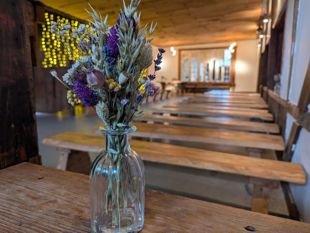 Dried flowers in a bud vase in a wedding chappel