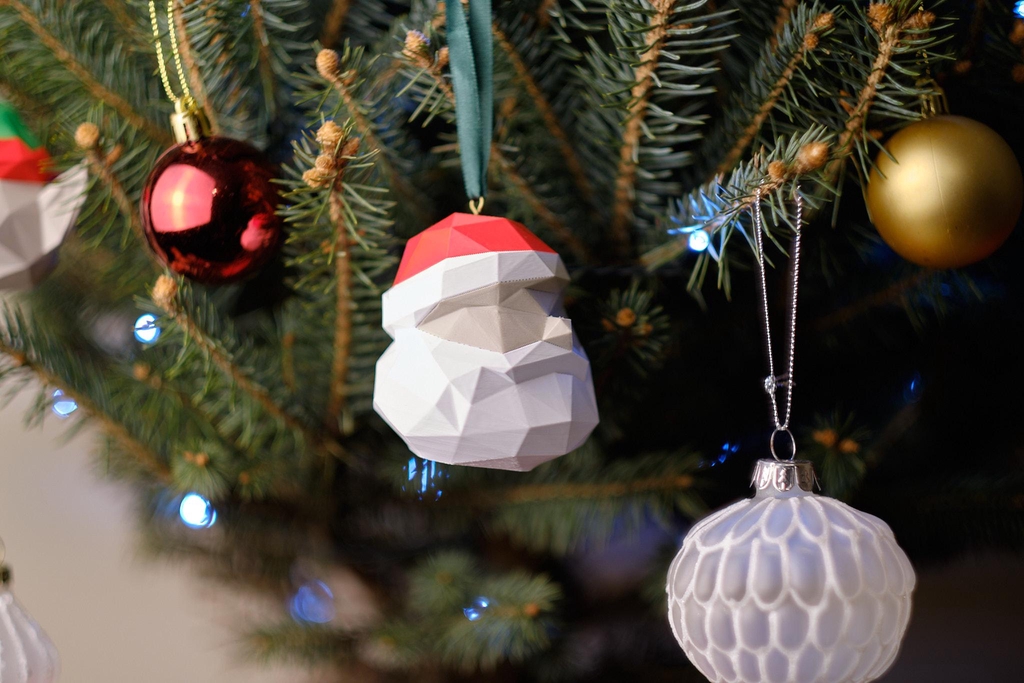 A pack of three festive baubles — Santa, Elf, and Penguin. 3D printed, thoughtfully made, and one of a kind.