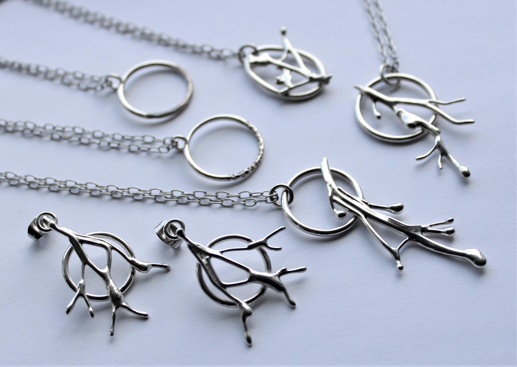 assorted silver jewellery in a molten metal style