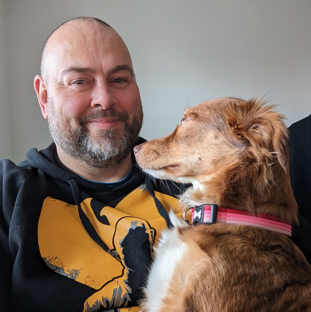 Russell Thorn the artist holding Missy, his mixed breed rescue dog from Bulgaria