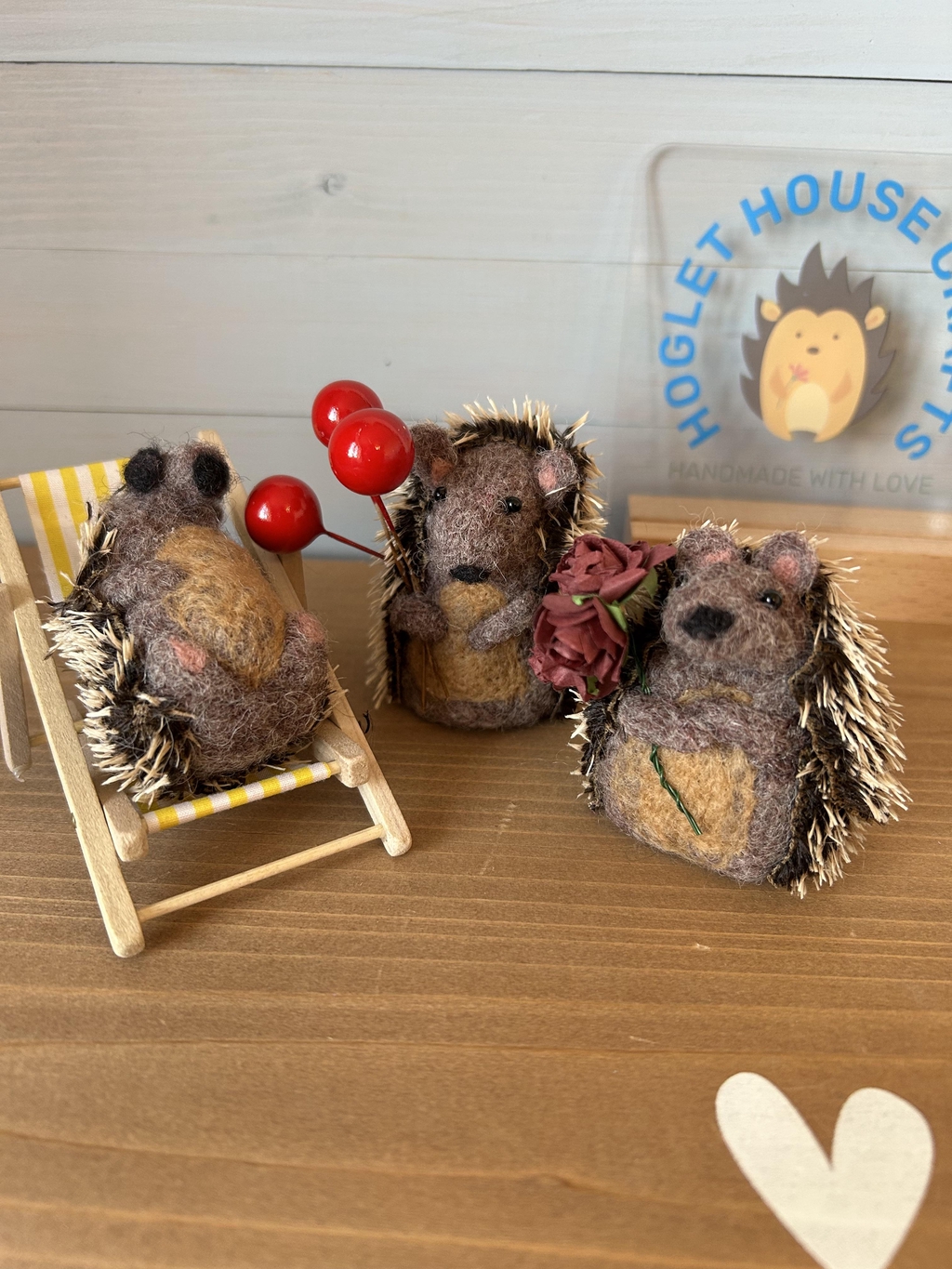 Three needle felted hedgehogs. The sunbather. The celebration. The flower giver.
