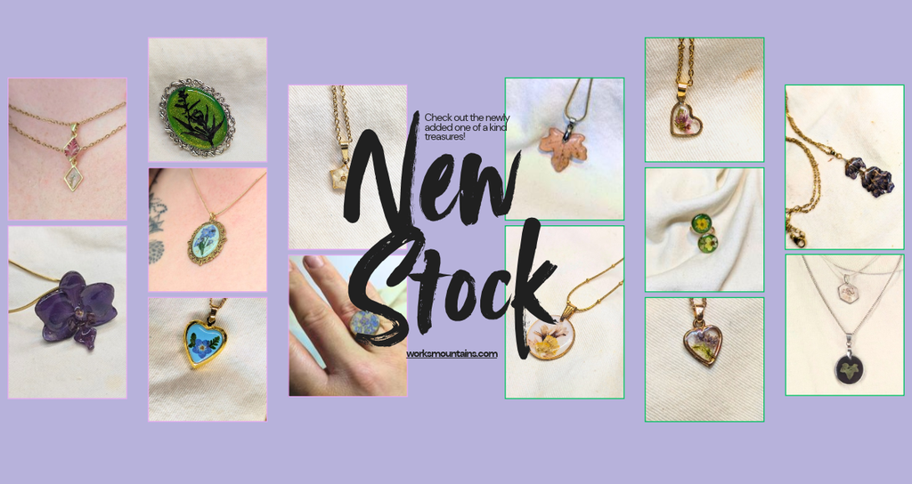 New stock banner advising to check out the new stock that has been added to the website, including photos of real leaf and flower necklace, real flower rings and other flower pendants 