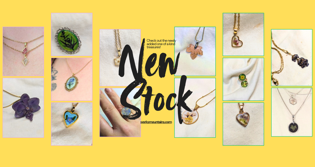 New stock banner advising to check out the new stock that has been added to the website, including photos of real leaf and flower necklace, real flower rings and other flower pendants 