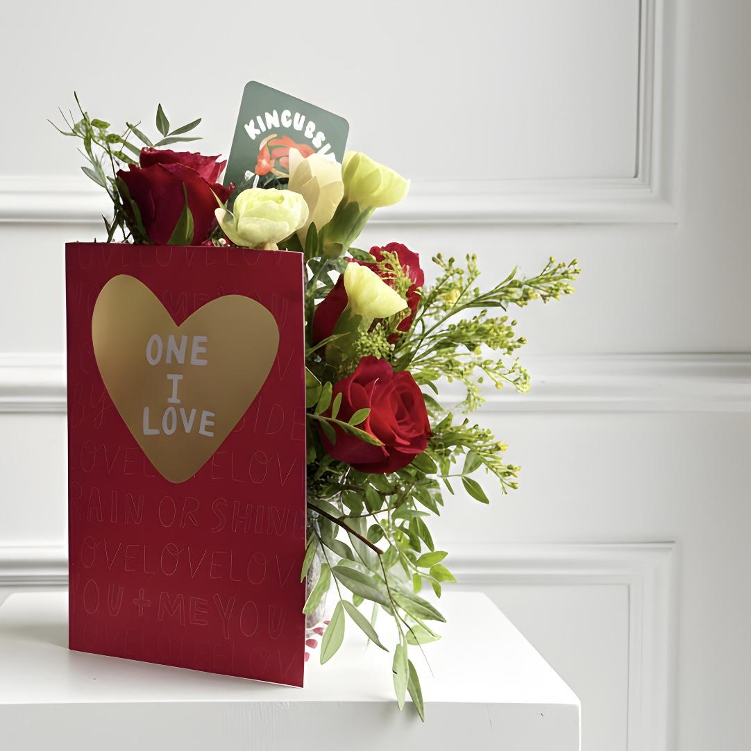 A valentines card filled with fresh flowers