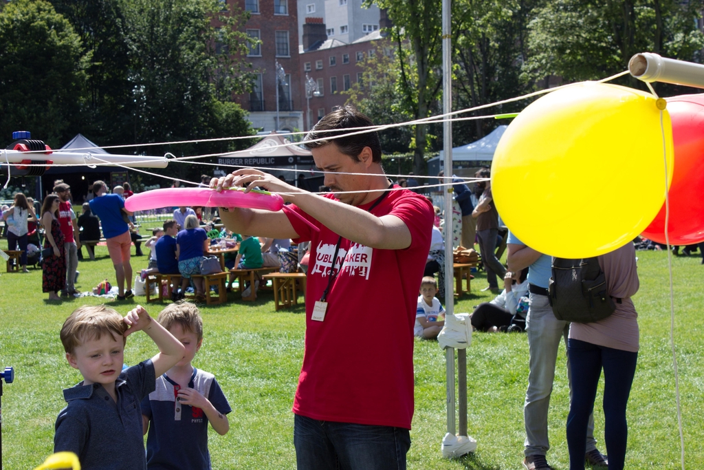 Maker with balloons and children.
