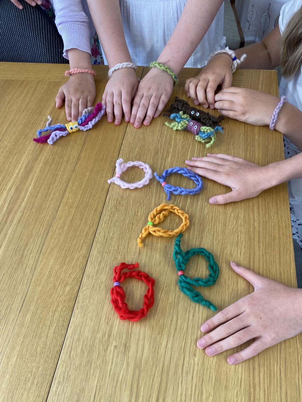 Children showing off their crocheted bangles.