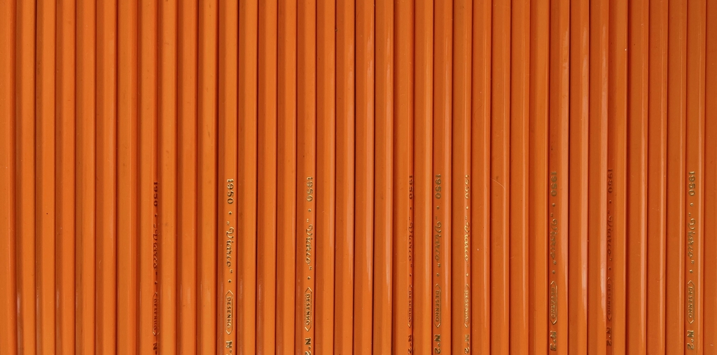 A clean, precise row of high-quality pencils Viarco 1950 lined up side-by-side.