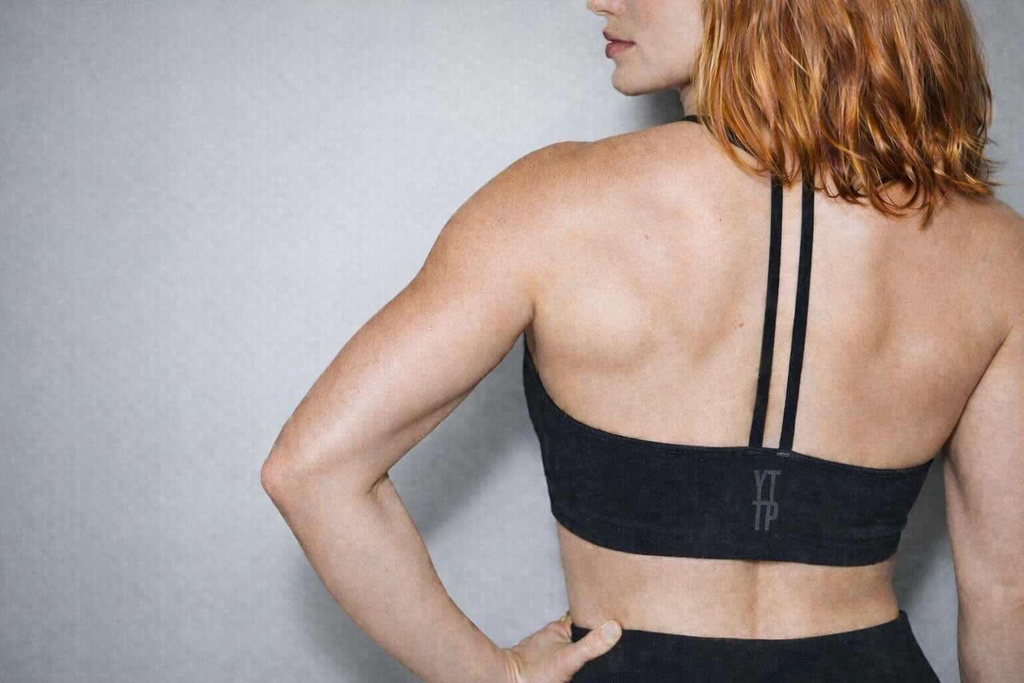 Woman wearing YTTP Activewear top
