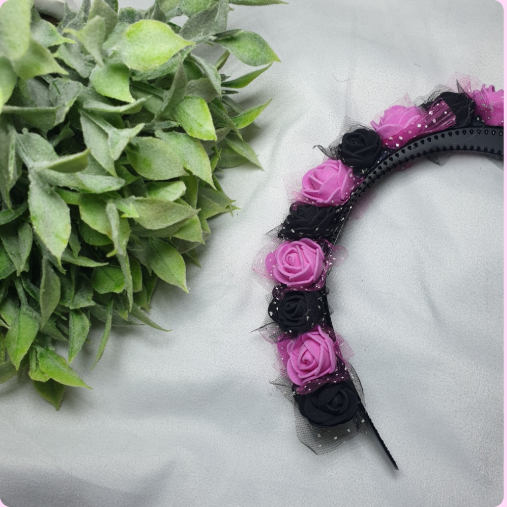 A pink and black flower crown