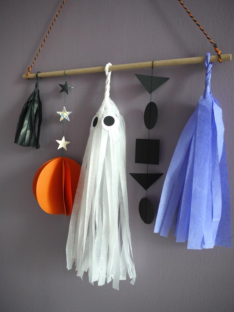 Halloween scene wall hanging with paper ghost, pumpkin, garland and tassels by Paper Street Dolls