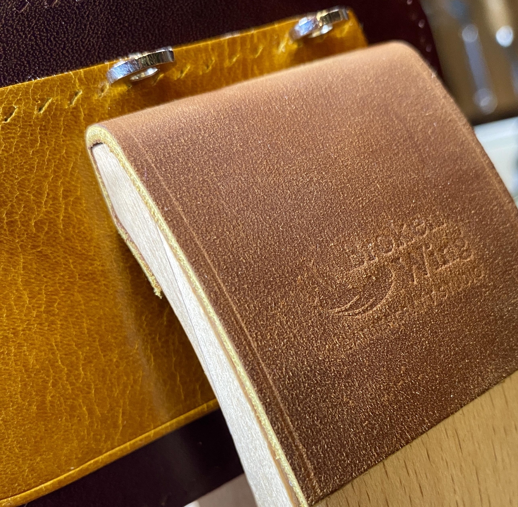 Background photo showing a piece of leathercraft clamped in the jaws of a wooden stitching pony, ready to be saddle-stitched.

Headline reads: "Individually Hand Crafted in our Scottish Workshop"

Text Reads: "We pride ourselves on only using tried, and tested traditional methods, so you get to enjoy the quality, and longevity of authentic traditional craftsmanship."

There is a button marked 'Explore' that can be clicked on access the product range.