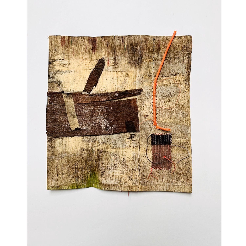 3D Modern minimalist textile inspired wall art - sculpture and assemblage

The image shows a yellow and brown piece of square tree bark.  On the left there is a dark brown rectangle with a small piece of masking tape attached.  On the right a black and great piece of weaving.  Above it, a thin orange strip of plastic has been stitched to the bark.
