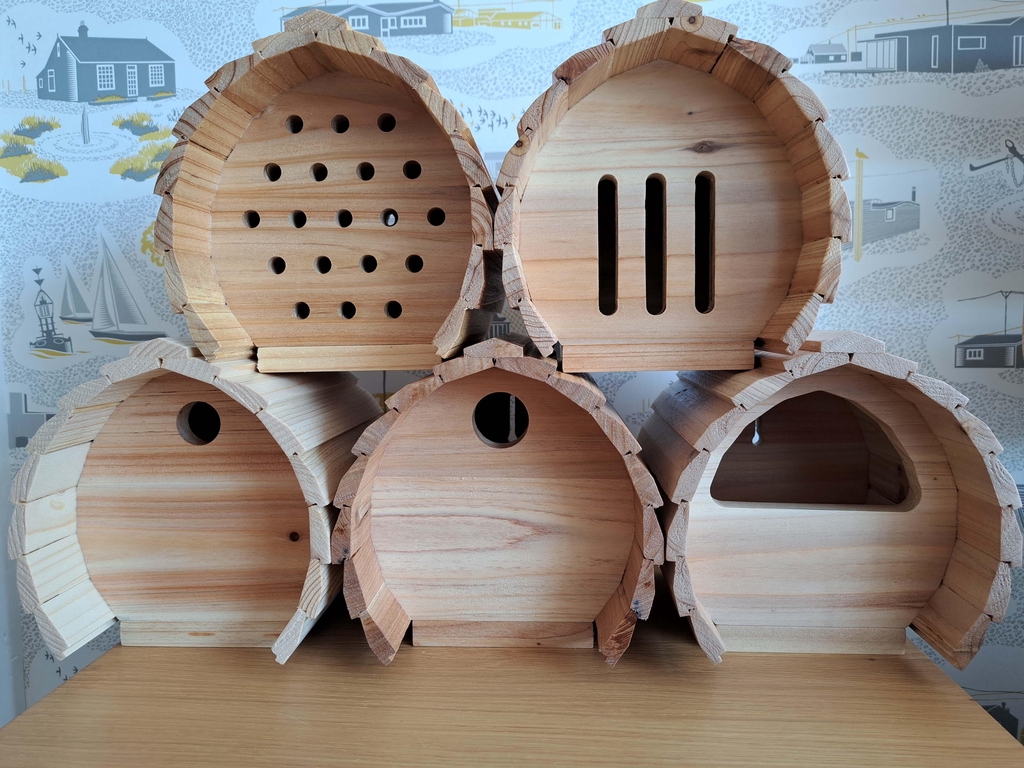 Varnished nesting boxes and bug and butterfly shelters