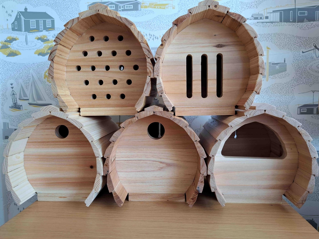 Varnished nesting boxes and bug and butterfly shelters
