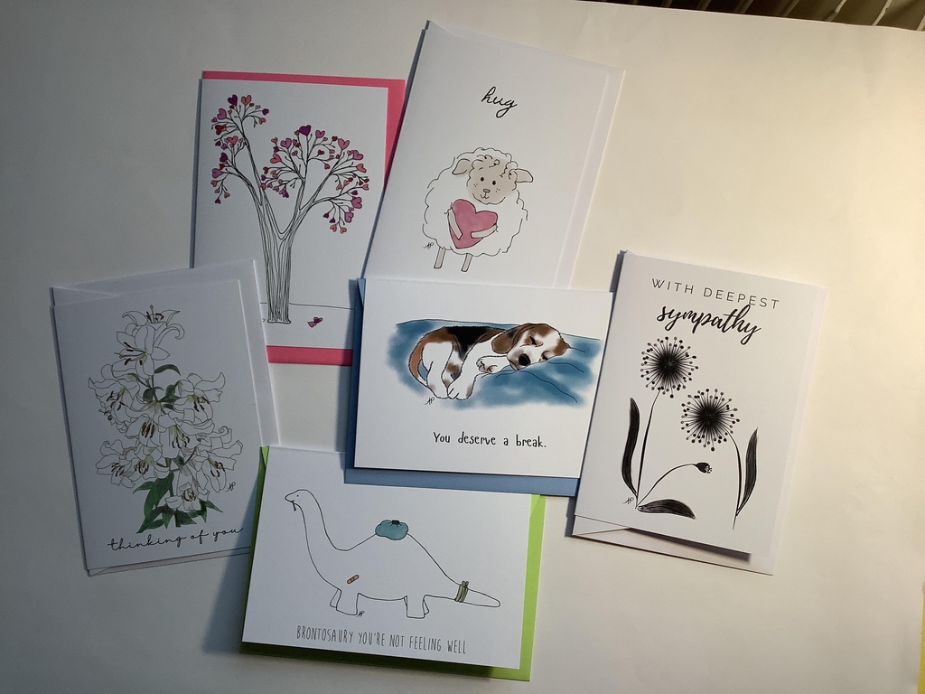 Bundle of assorted hand-drawn greeting cards for encouragement and sympathy