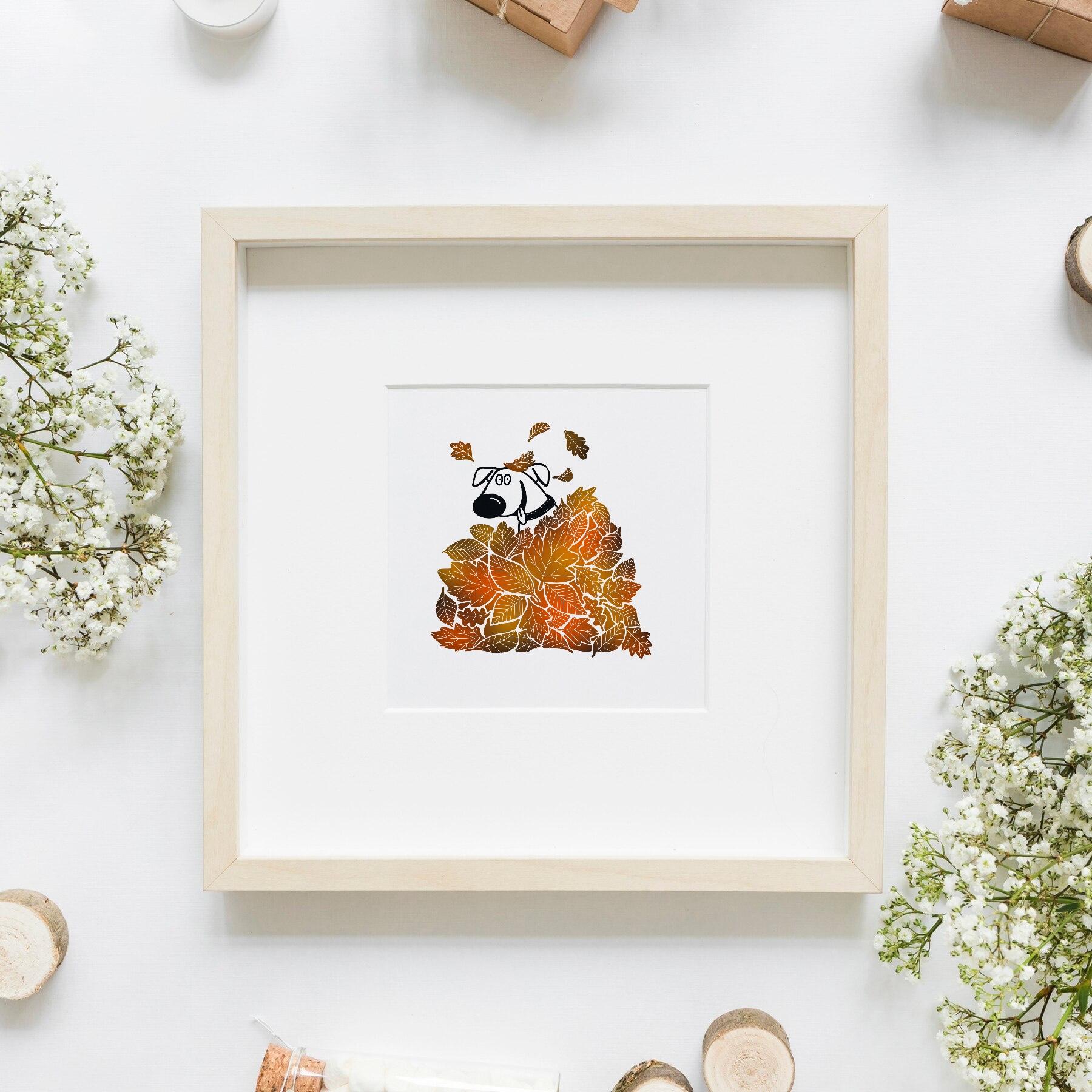 Framed illustration called Playtime, featuring a dog having fun in a big pile of autumn leaves.