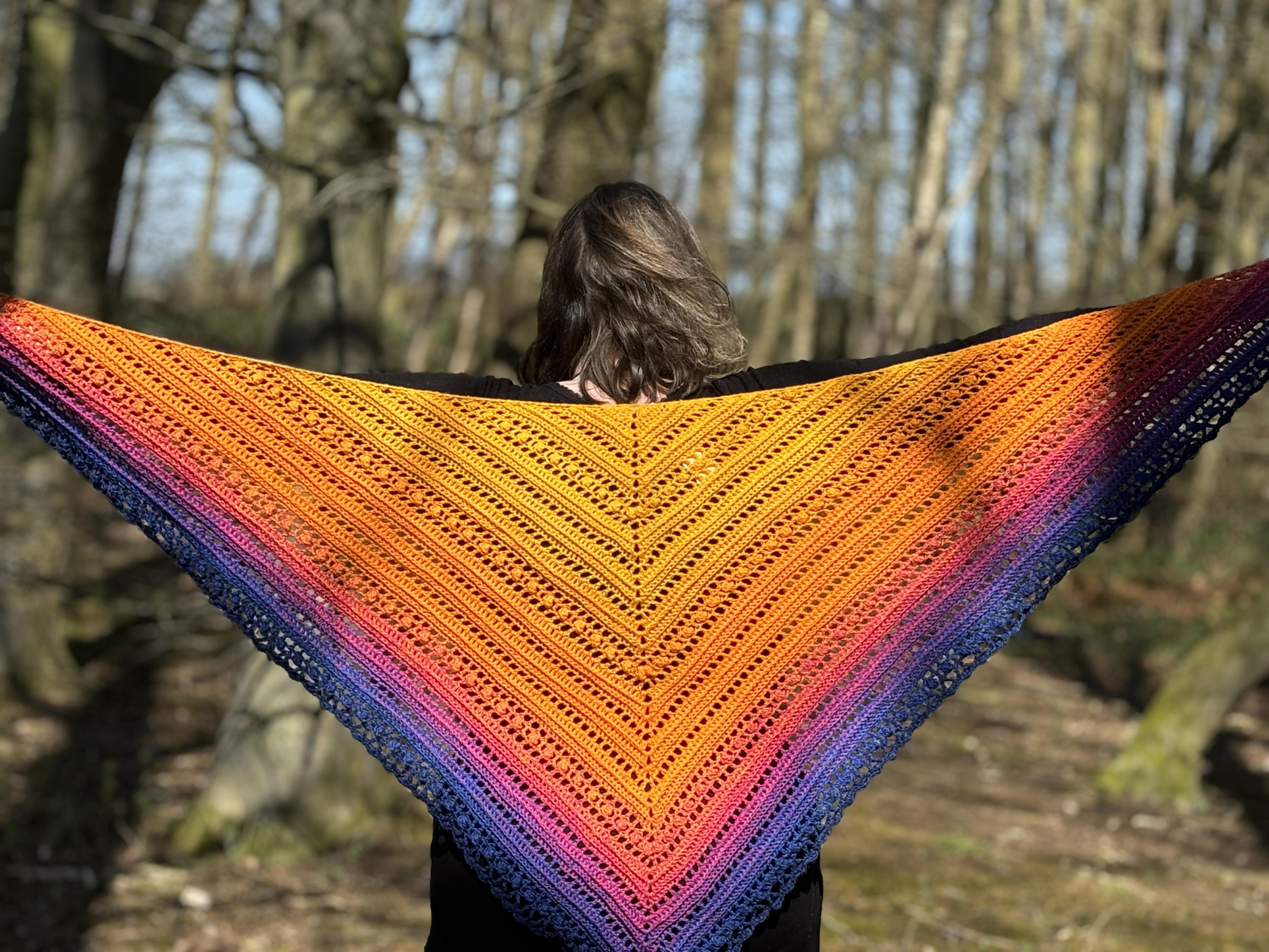 Collection of handmade crochet shawls and wraps from traditional textures to skulls, available in various colours and yarns.