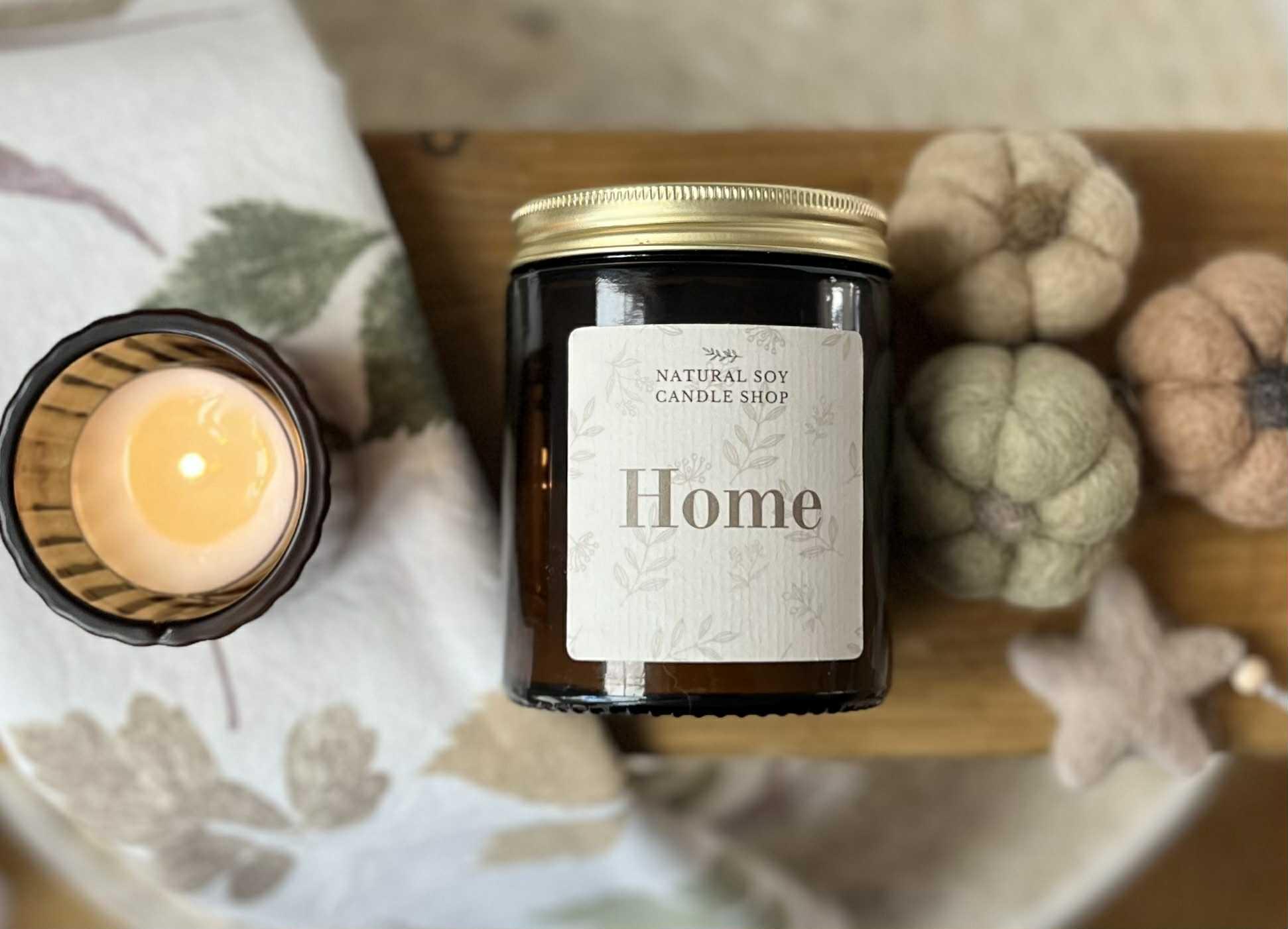 Soy Candle in a amber glass jar with gold lid. Soy candles is the title.