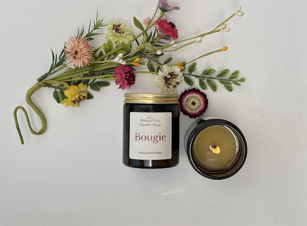 Two candles for £20. Candle is in a amber glass jar with natural soy candle shop on the label.