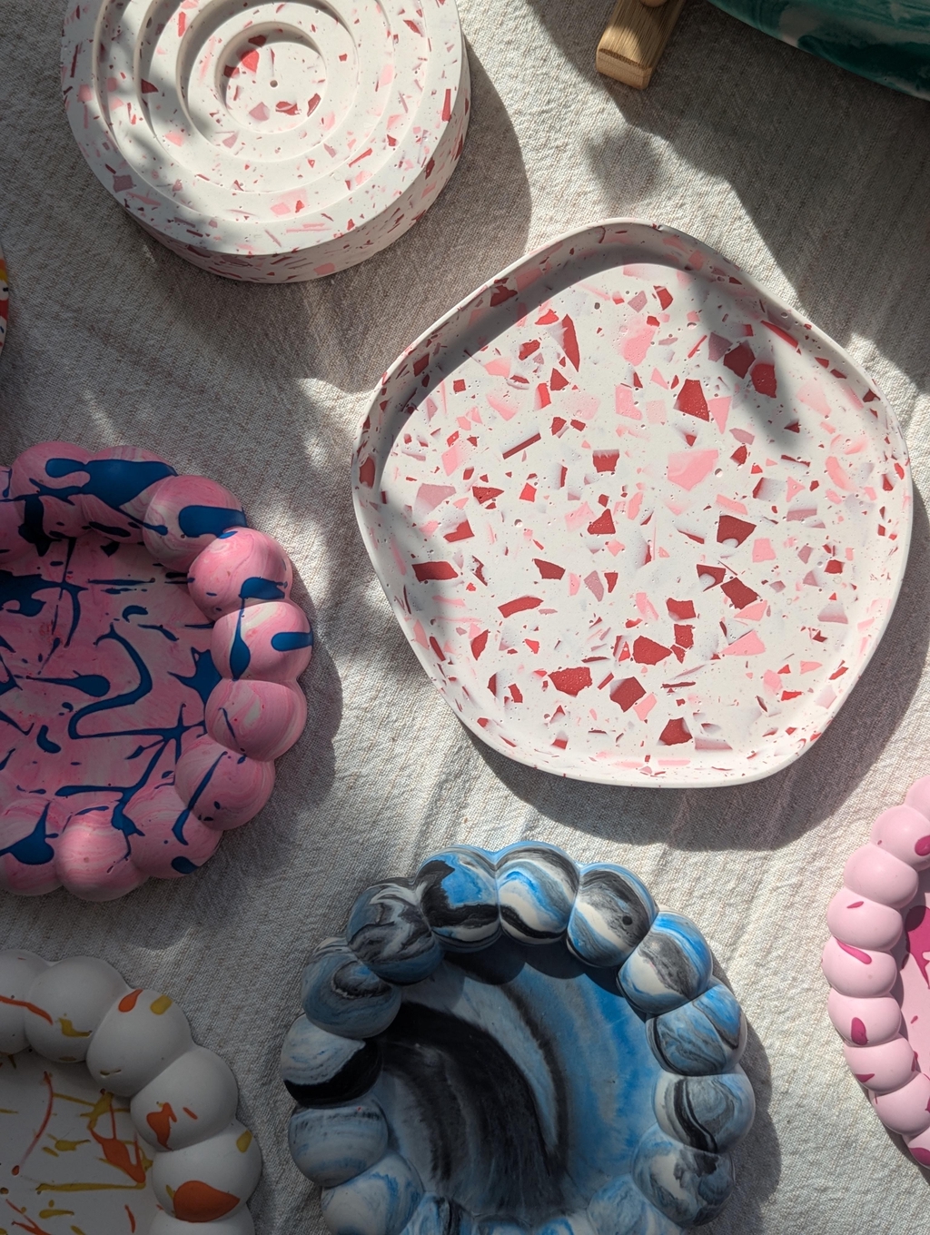 Colourful trays on a beige tablecloth