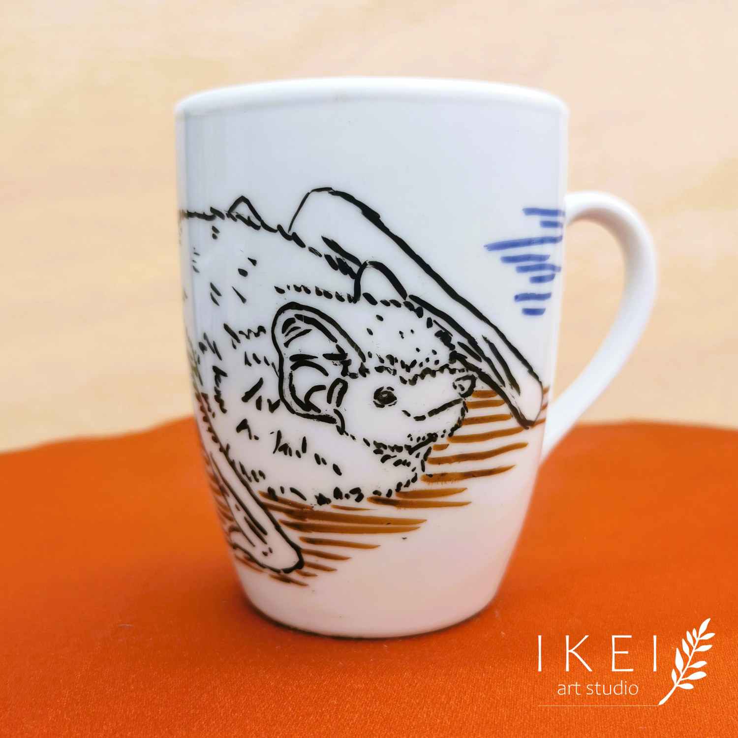 Hand-illustrated custom mugs by IKEI art studio