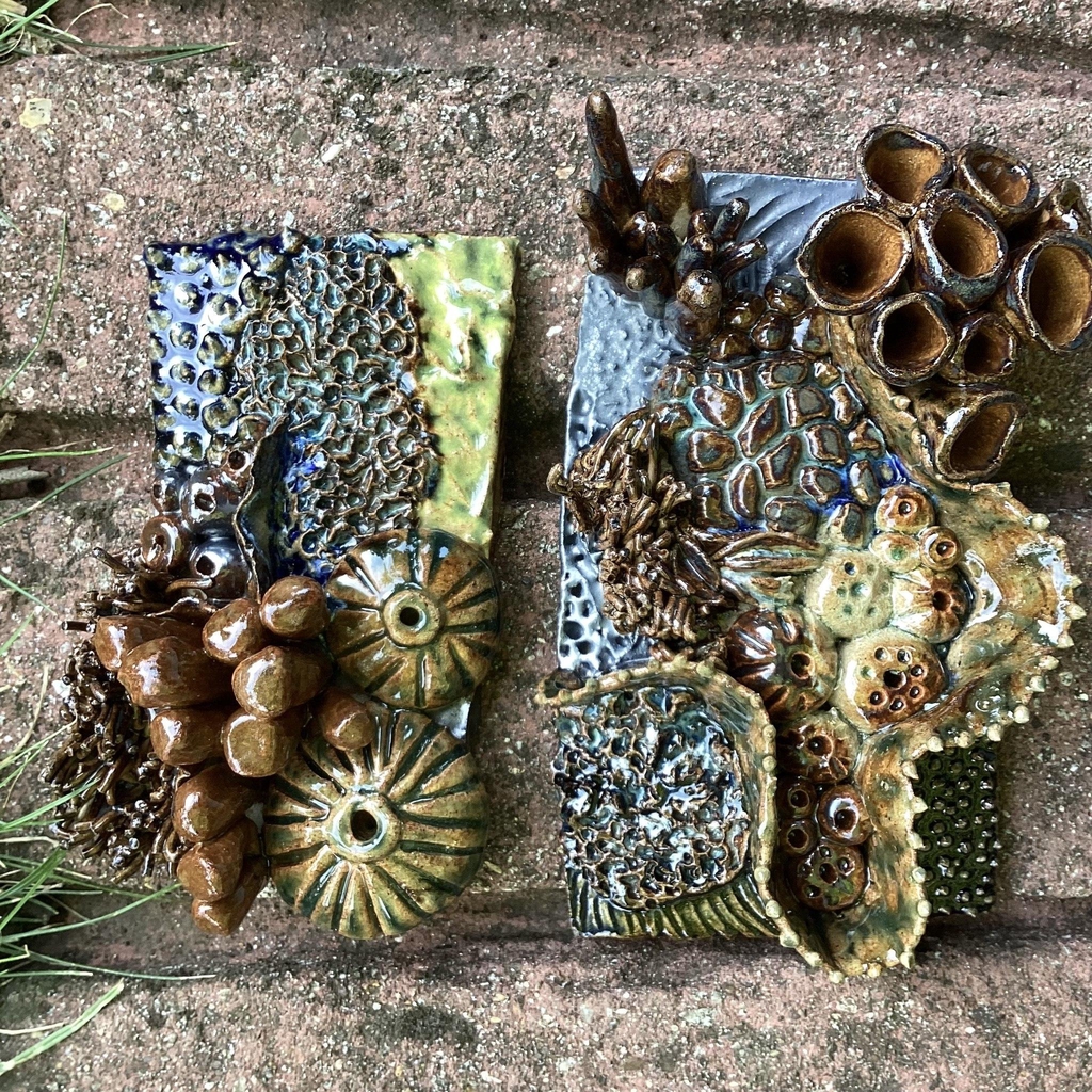 A beautiful ceramic orchid flower in a vase.