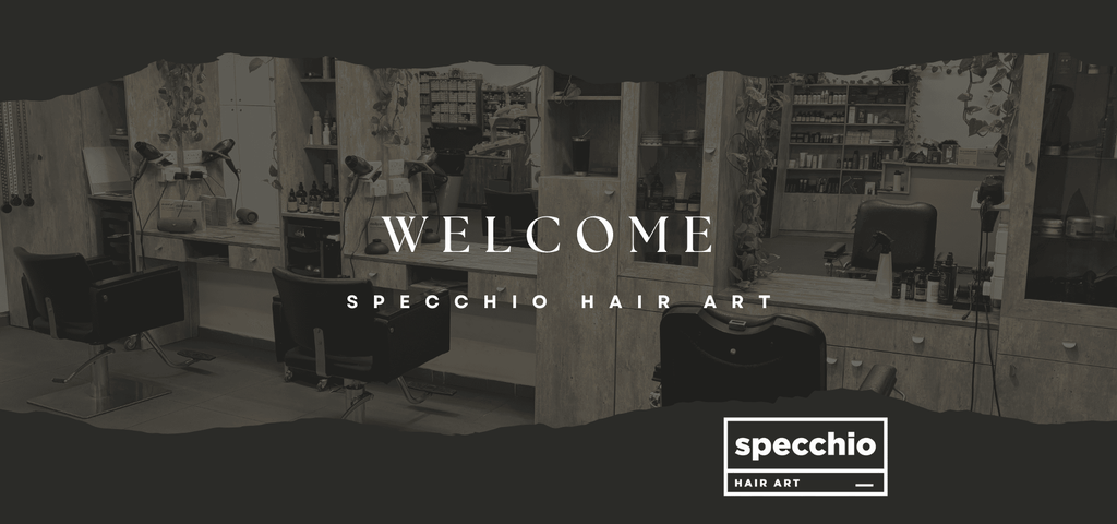 Interior of Specchio Hair Art salon showing styling chairs, mirrors and professional hair care products in a modern hair studio.