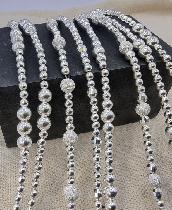 image of silver bracelets