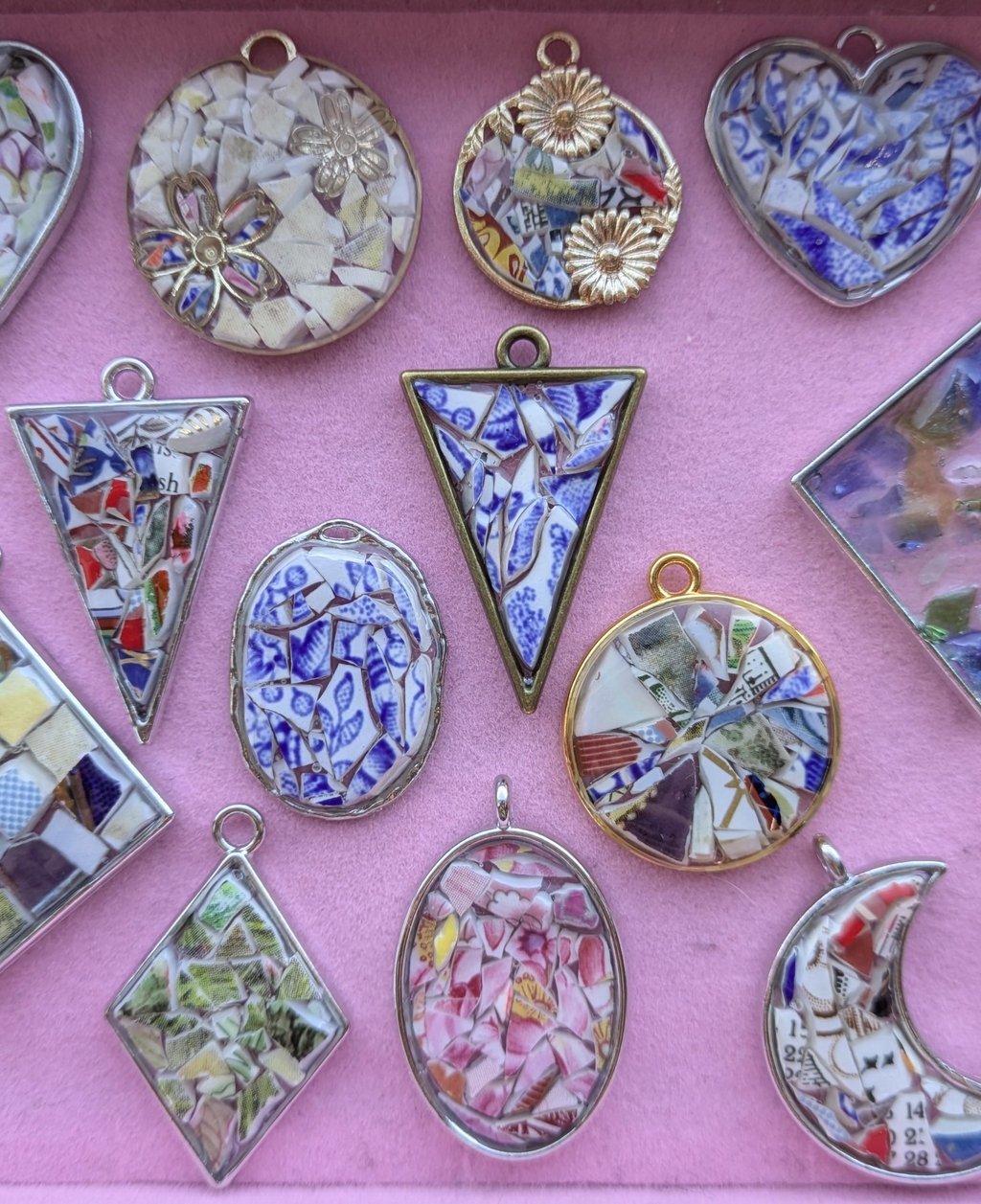 Resin pendants made with fragments of leftover pieces of vintage china.