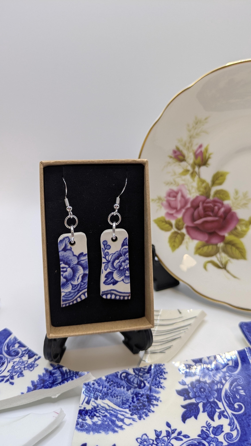 Handmade earrings made from vintage plates, presented in a gift box. 